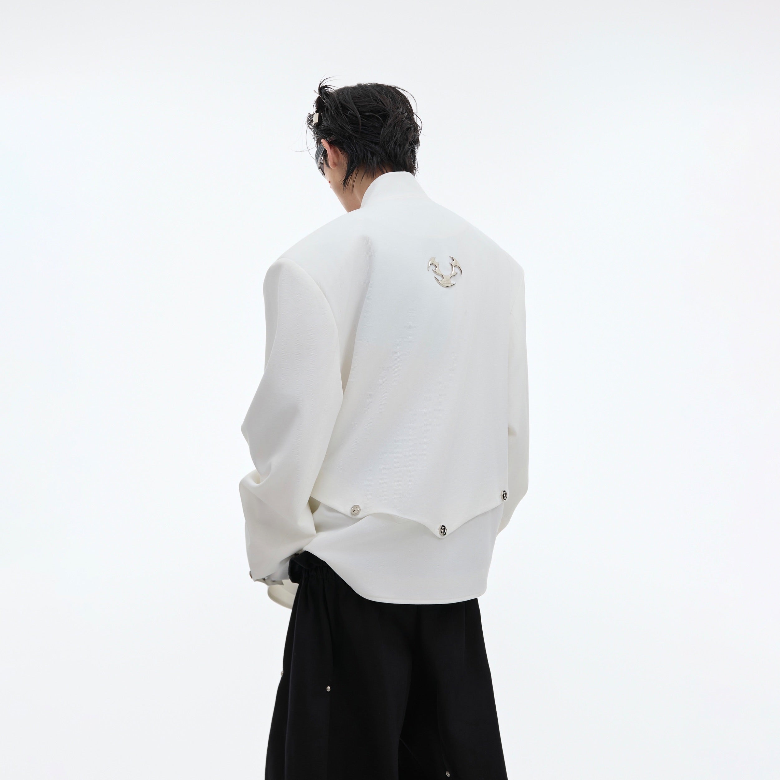 Back view of the fashion-forward deconstructed blazer featuring sparkling glitter accents and oversized cut