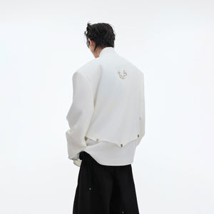 Back view of the fashion-forward deconstructed blazer featuring sparkling glitter accents and oversized cut