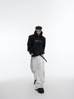 Side profile view of the statement hoodie showing its cloud-soft fabric and modern silhouette
