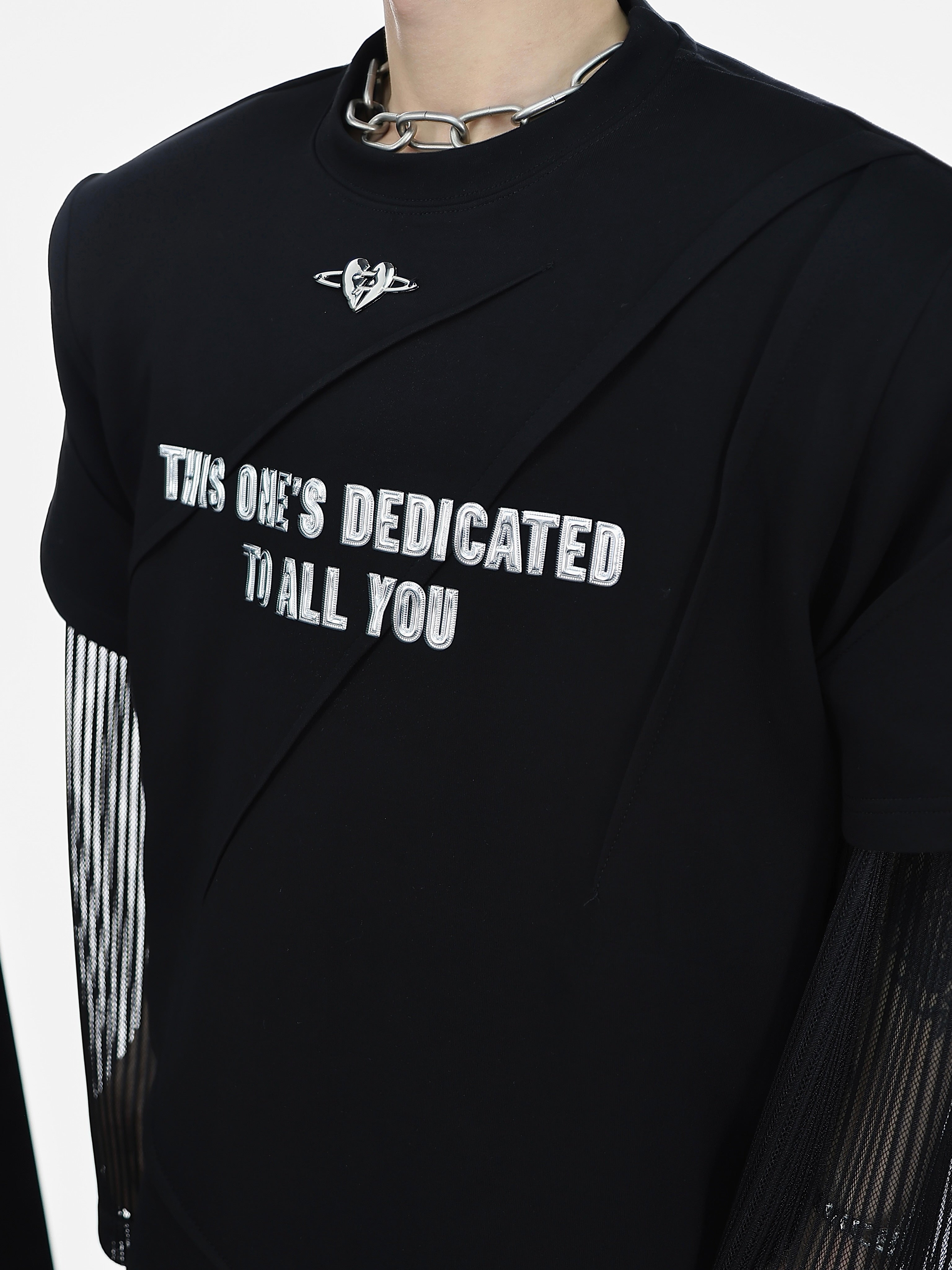 Back view of men's streetwear tee showcasing the full oversized fit and stylish metal graphic print design