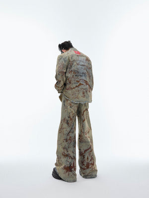 Front view of grunge-style denim jacket featuring distressed patches and vintage wash for edgy street fashion