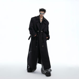 Close-up detail of premium fabric and construction on fashion-forward deconstructed trench coat