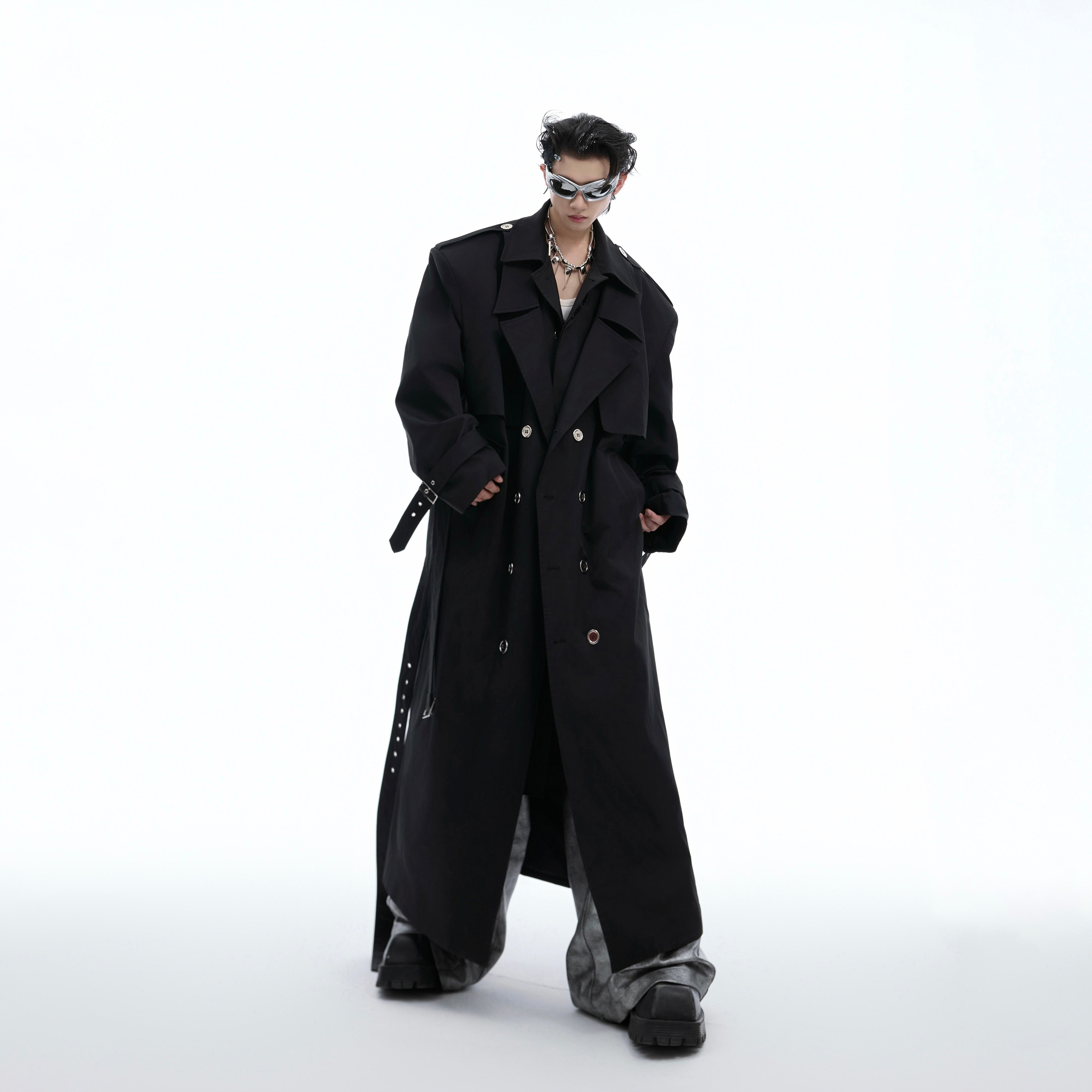 Close-up detail of premium fabric and construction on fashion-forward deconstructed trench coat