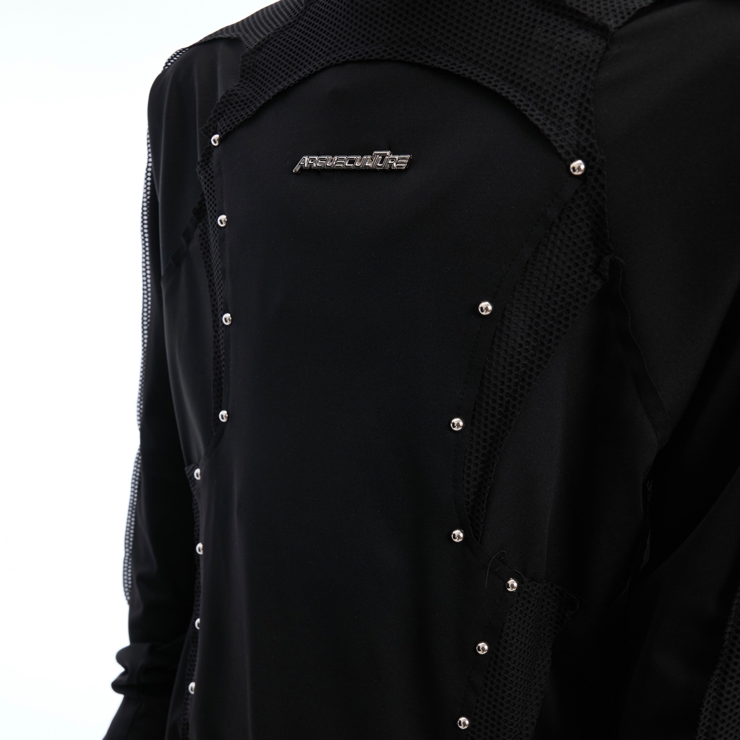 Back view of deconstructed mesh panel tee showing unique cut-out design and lightweight polyester fabric