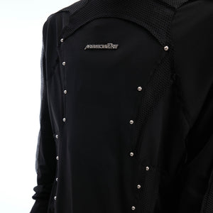 Back view of deconstructed mesh panel tee showing unique cut-out design and lightweight polyester fabric