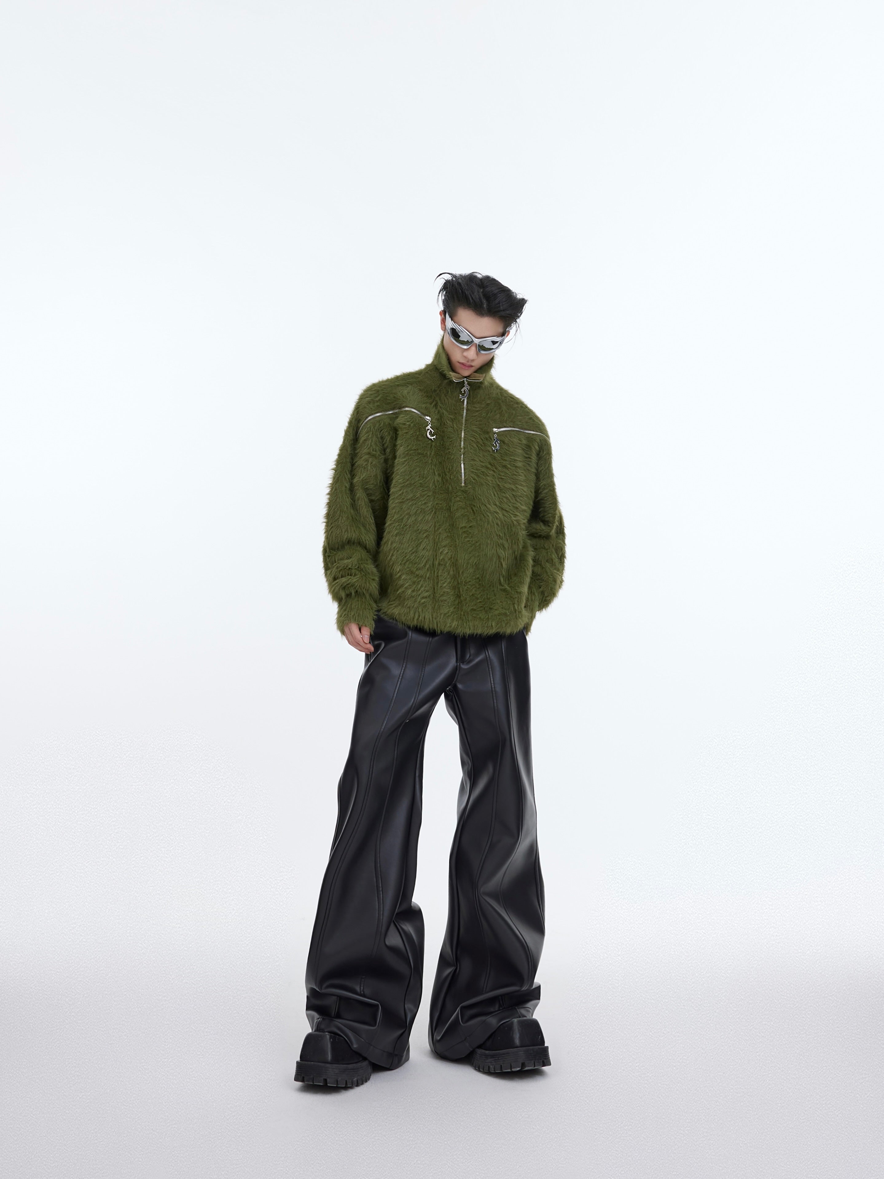 Styling example of high-waist leather pants paired with urban streetwear for a fashion-forward look