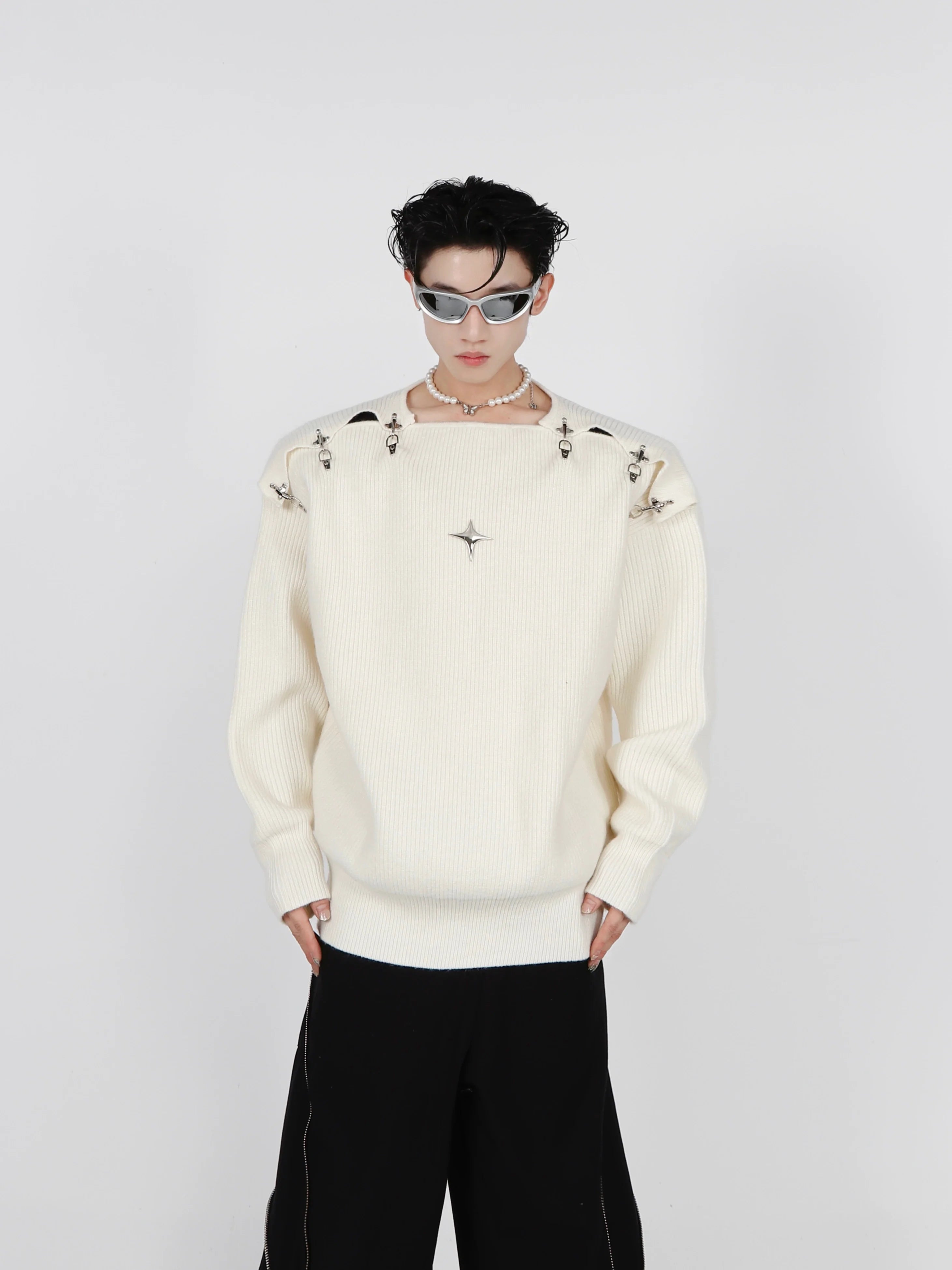 Trendy off-shoulder hollow-knit sweater with industrial metal buckle detailing for streetwear fashion