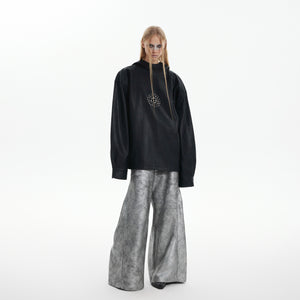 Back view of edgy punk jacket featuring metal stud accents and oversized hood design