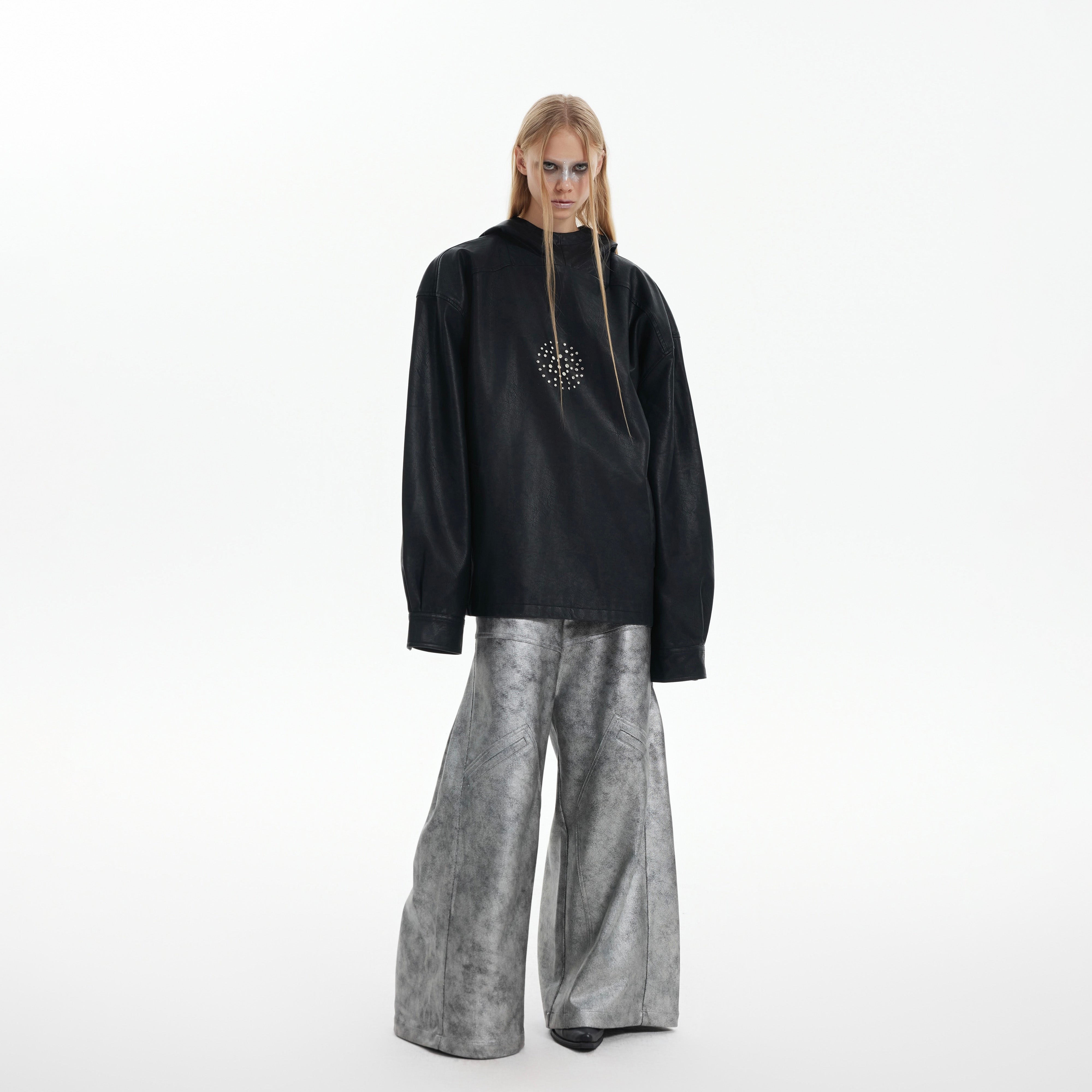 Back view of edgy punk jacket featuring metal stud accents and oversized hood design