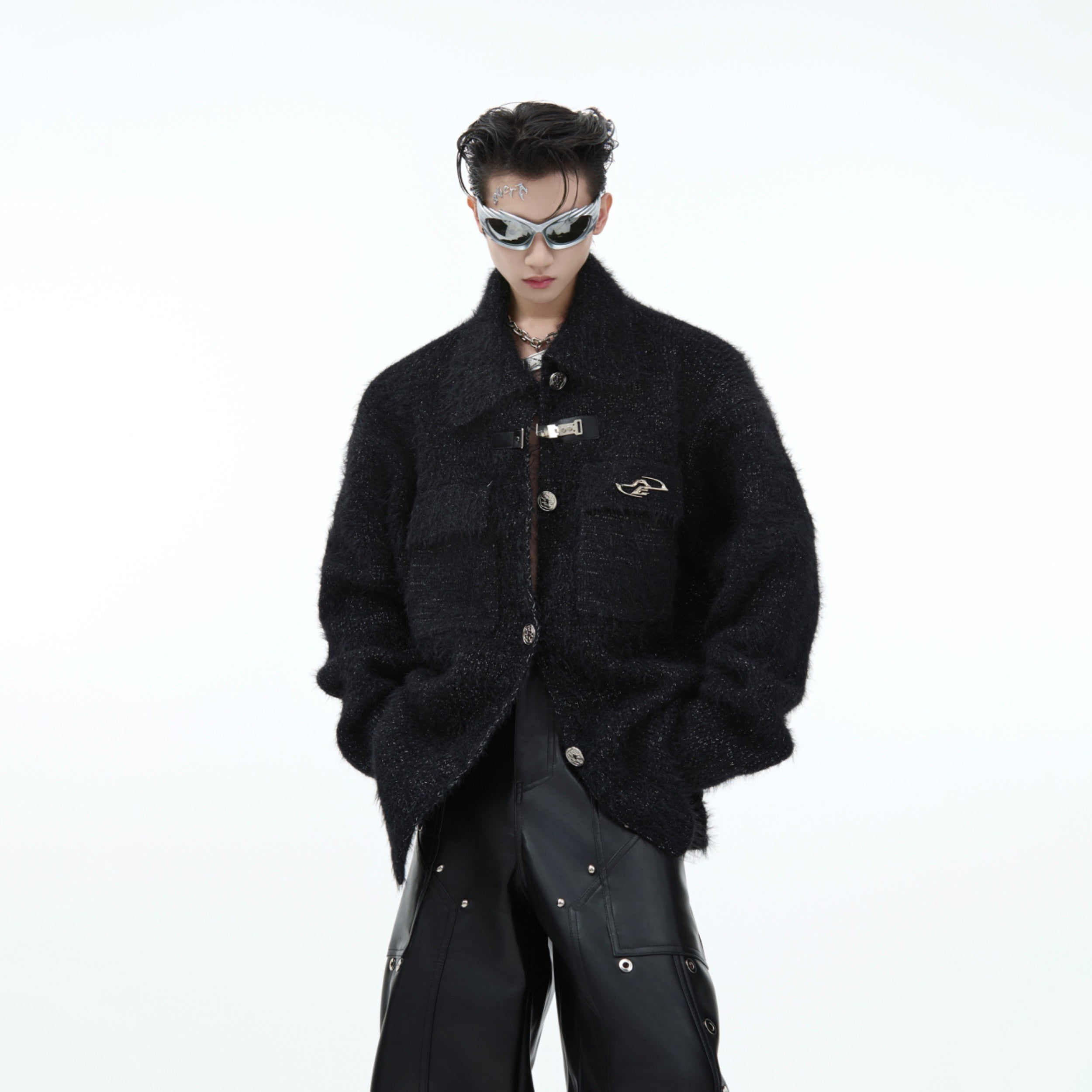 Model wearing oversized plush knit sweater showing the relaxed fit and cozy winter streetwear look