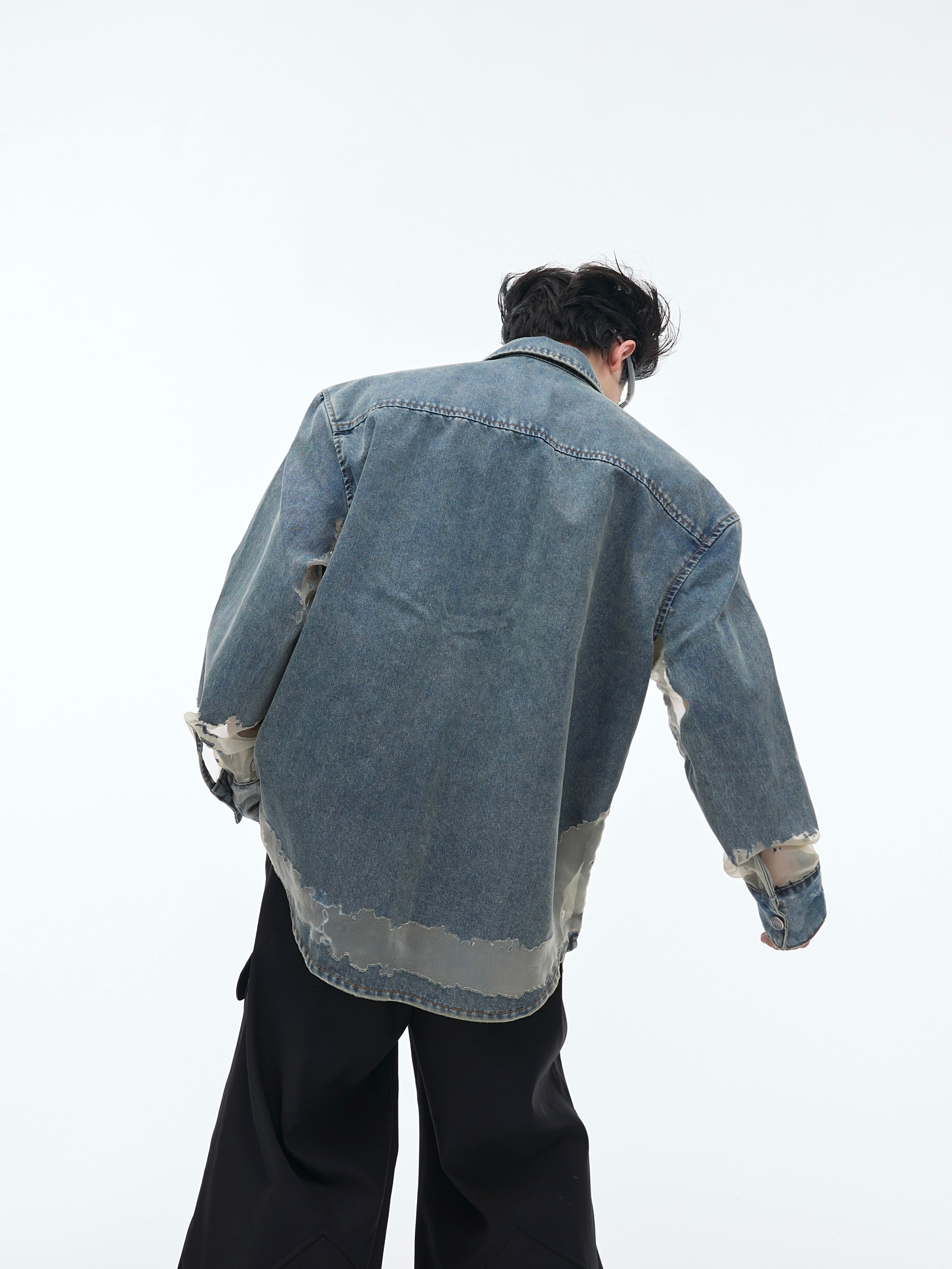 Back view showing lace trim accents on this deconstructed denim top, perfect for fashion-forward streetwear looks