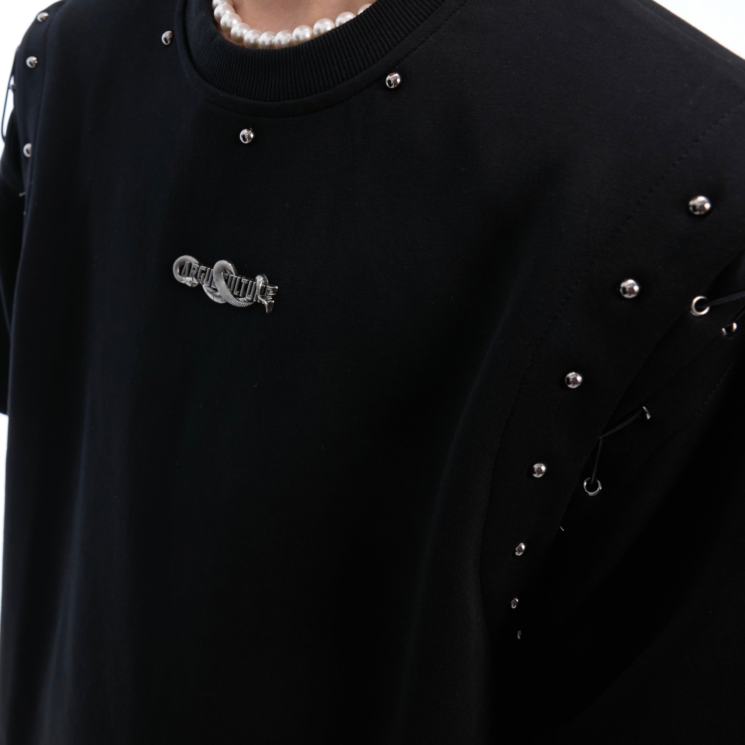 Close-up of breathable cotton crop tee with adjustable lace-up detail for perfect fit