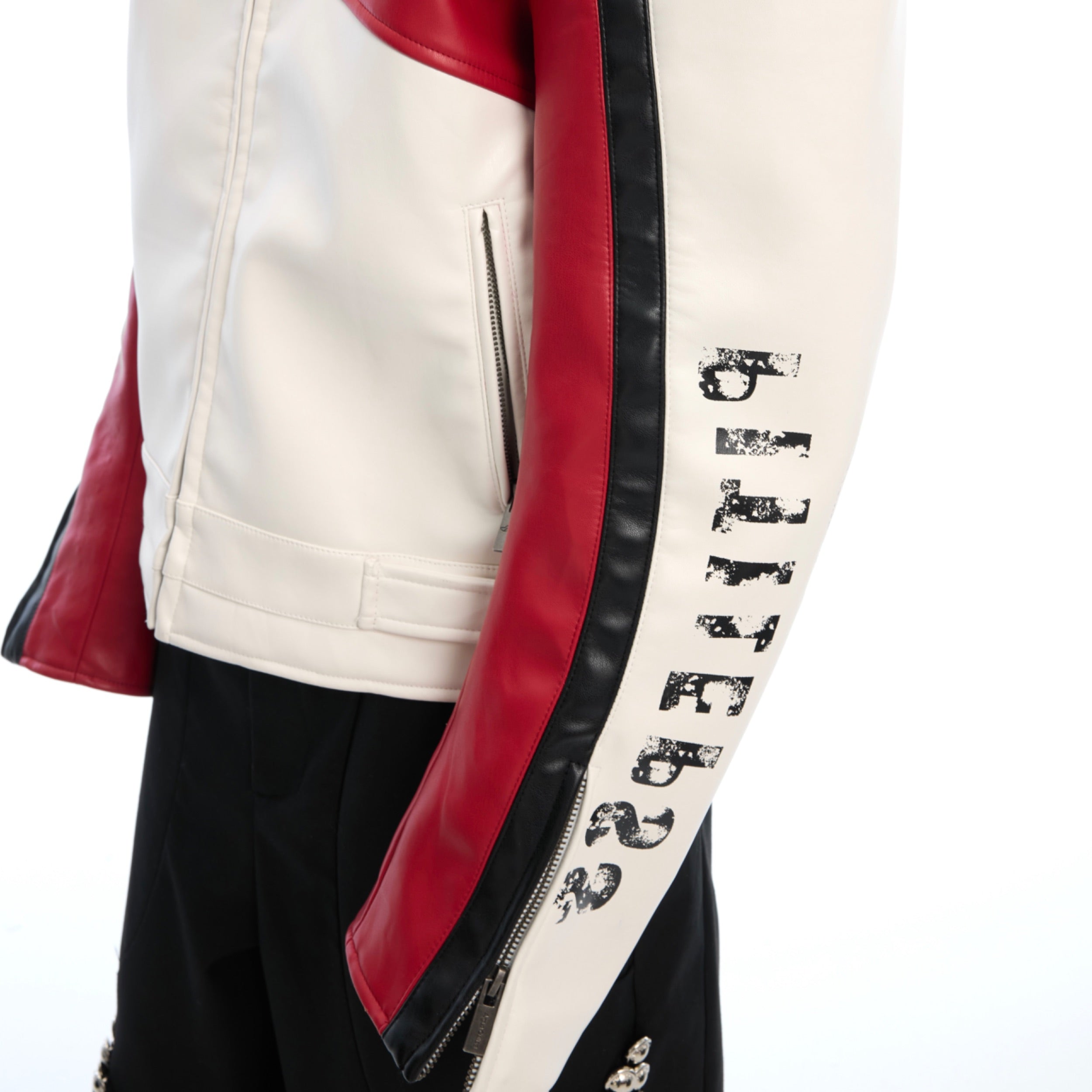 Side profile of slim fit biker jacket showing color block design and premium stitching