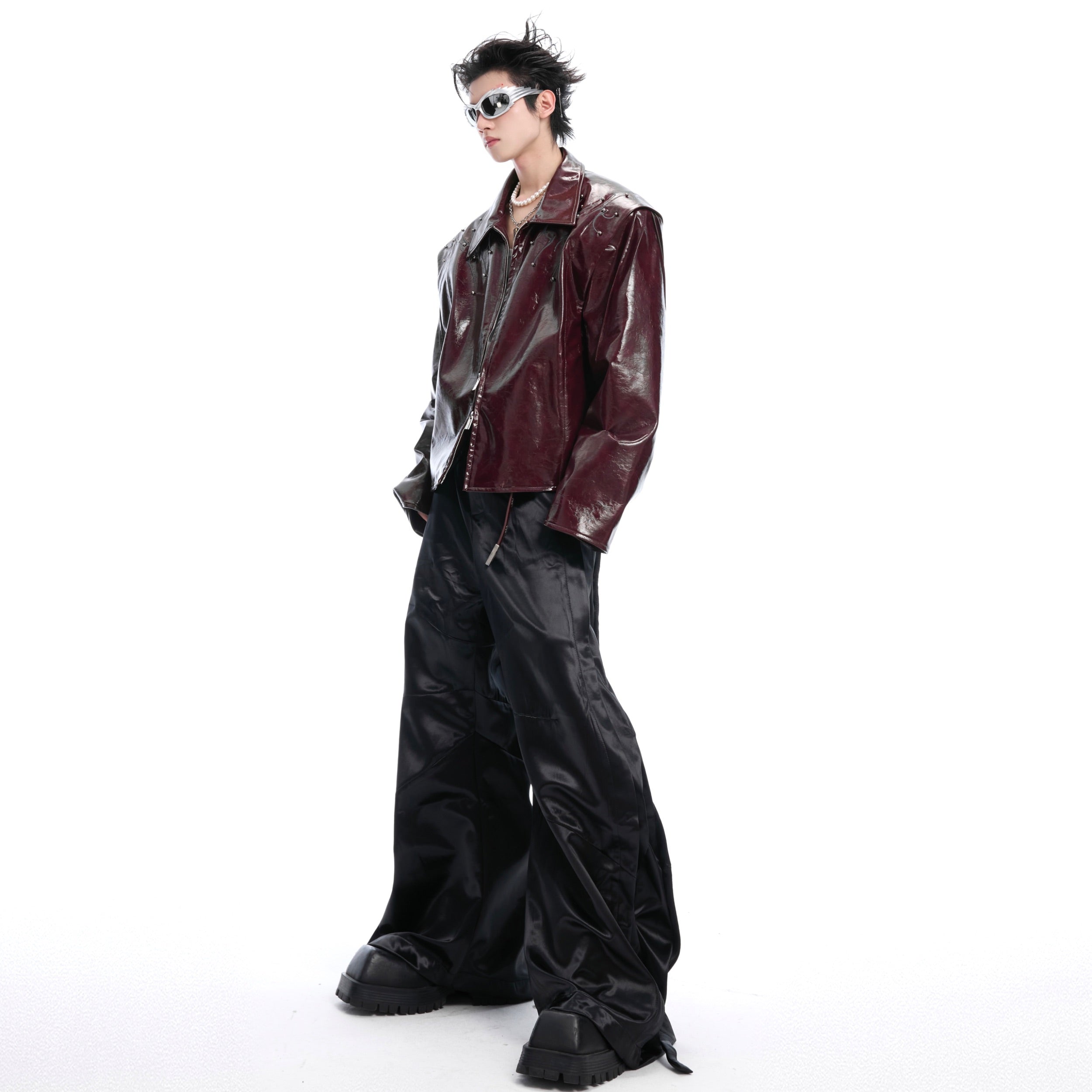 Side angle showcasing the futuristic cut and glossy texture of this avant-garde motorcycle jacket