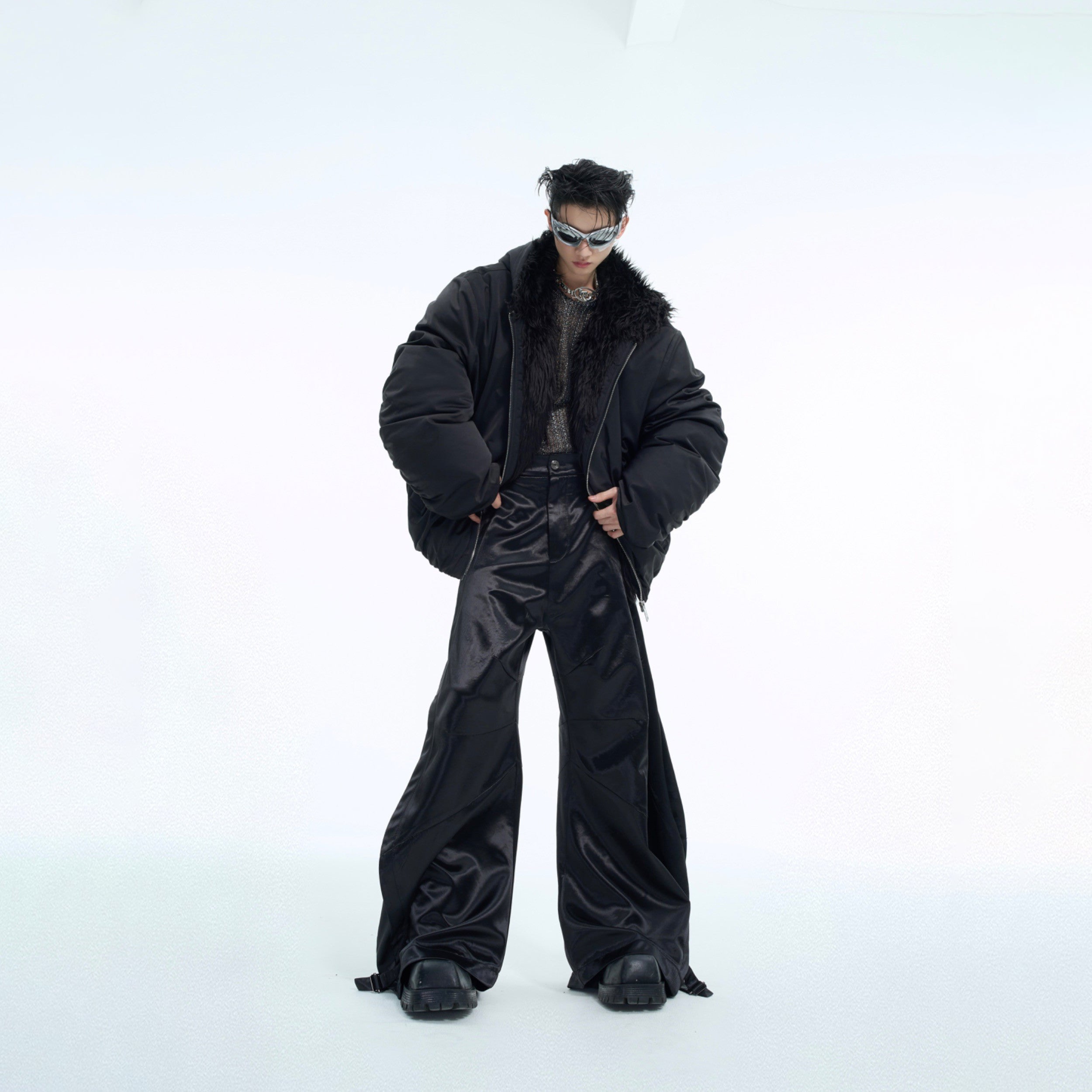 Back view of liquid metal wide-leg pants highlighting the unique drape and streetwear aesthetic