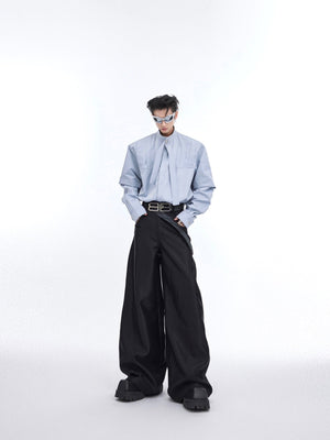 Back view of streetwear shirt featuring artistic deconstructed pleating and oversized fit