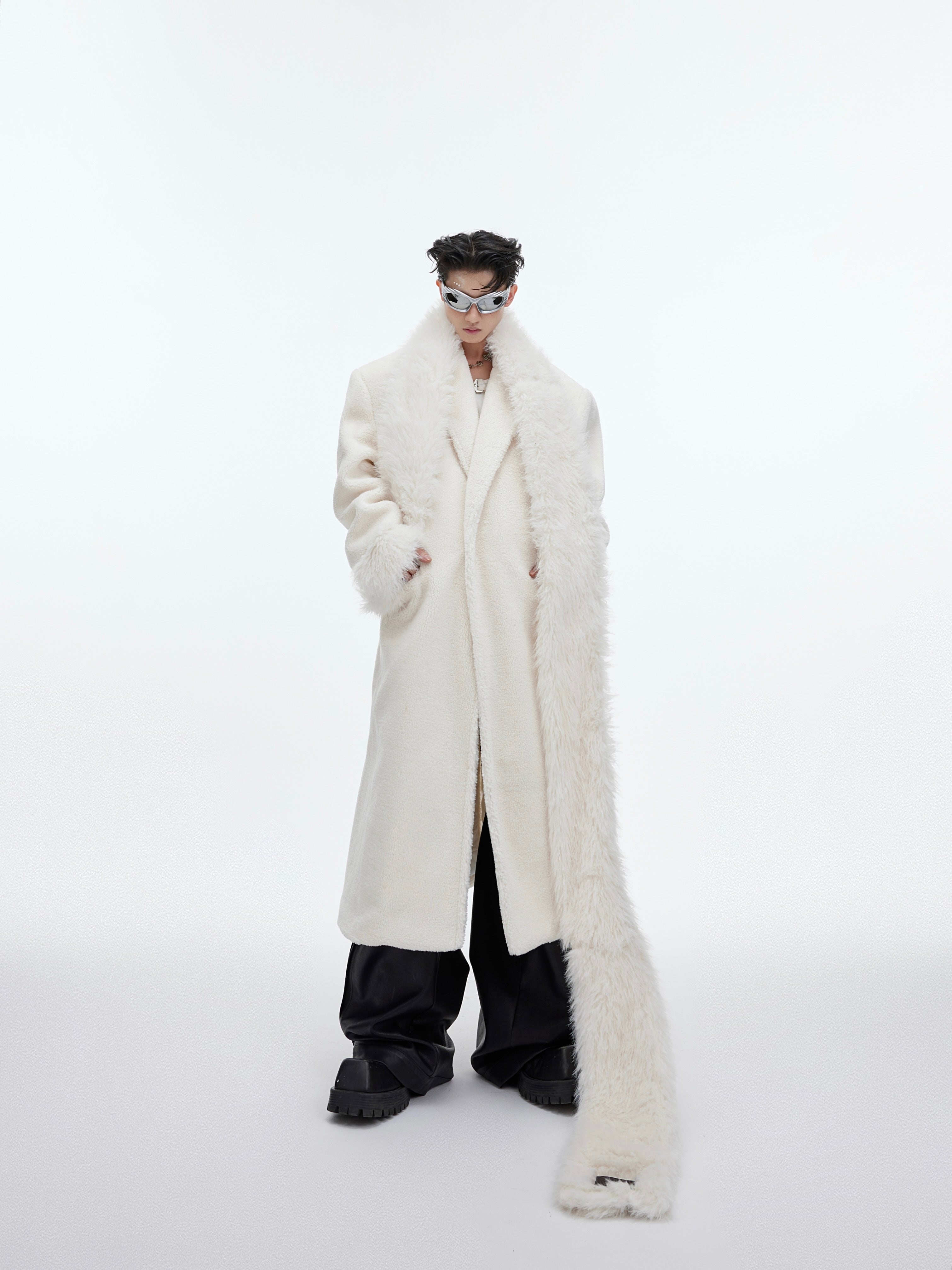 Close-up of premium eco-conscious wool blend fabric on this deconstructed men's trench coat with urban edge