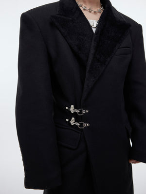 Side angle showcasing the waist-cinching design of this fashionable long tweed coat with metal buttons
