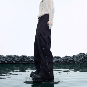 Close-up of the distressed fabric and metal hardware details on these cyberpunk-inspired cargo pants