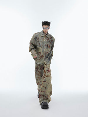 Loose fit distressed denim jacket with deconstructed sleeves and raw edge streetwear aesthetic