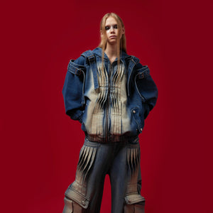 Street-style outfit featuring the oversized denim jacket layered over a hoodie for winter wear