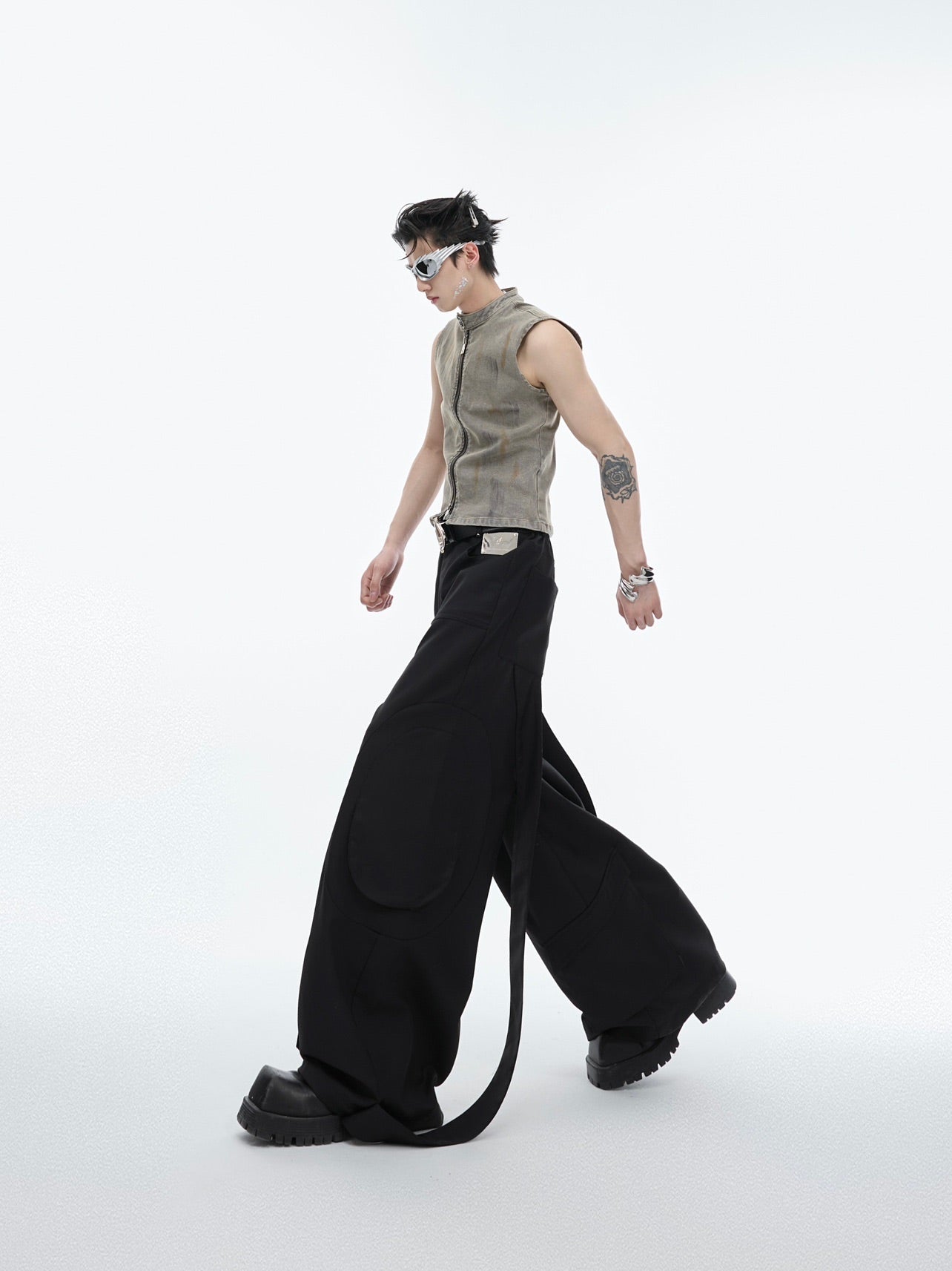 Rear view showing the distinctive ribbon accents on these urban style oversized trousers