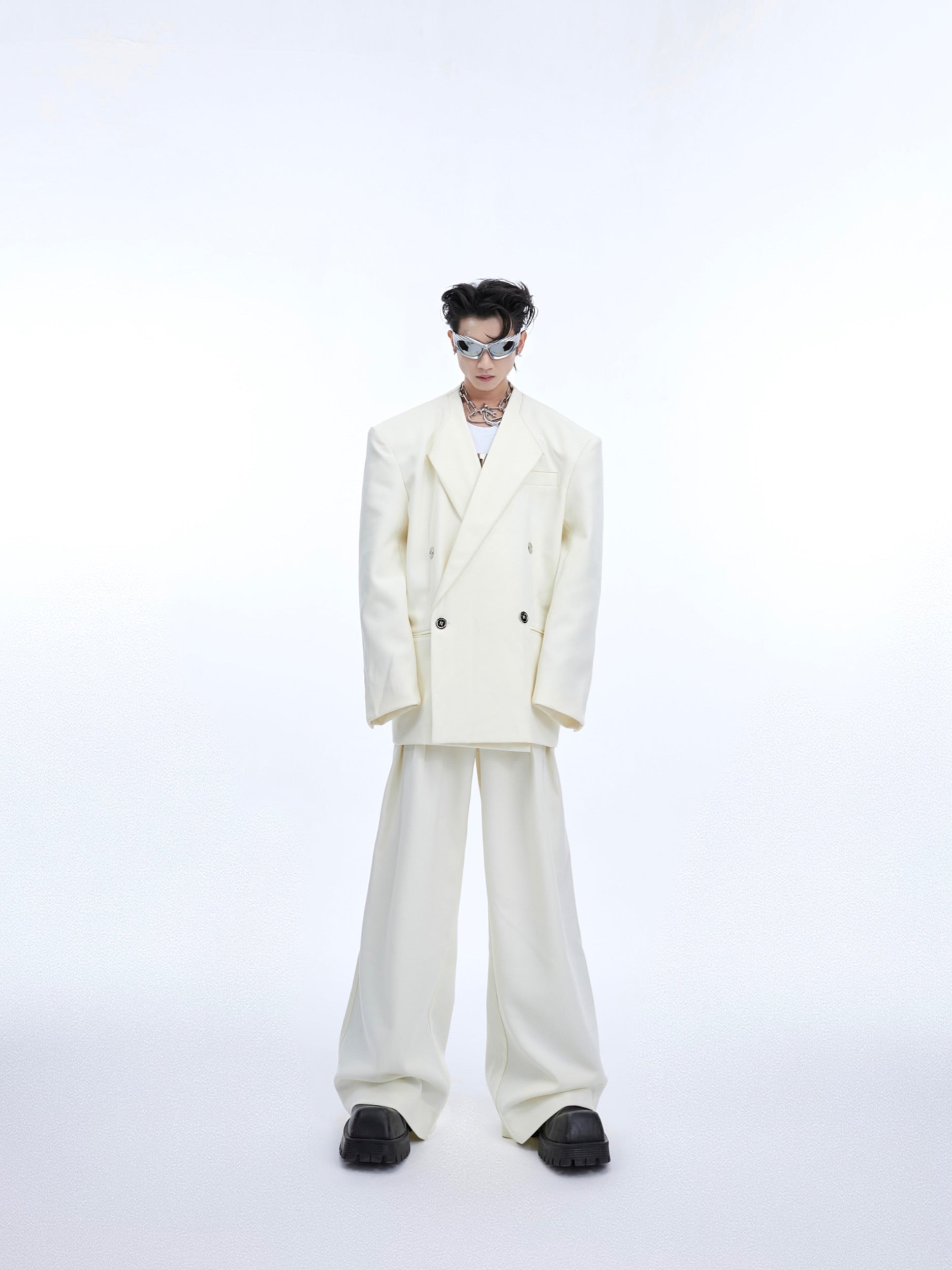 Side view of white deconstructed blazer showing loose fit and premium cotton blend fabric for comfortable streetwear