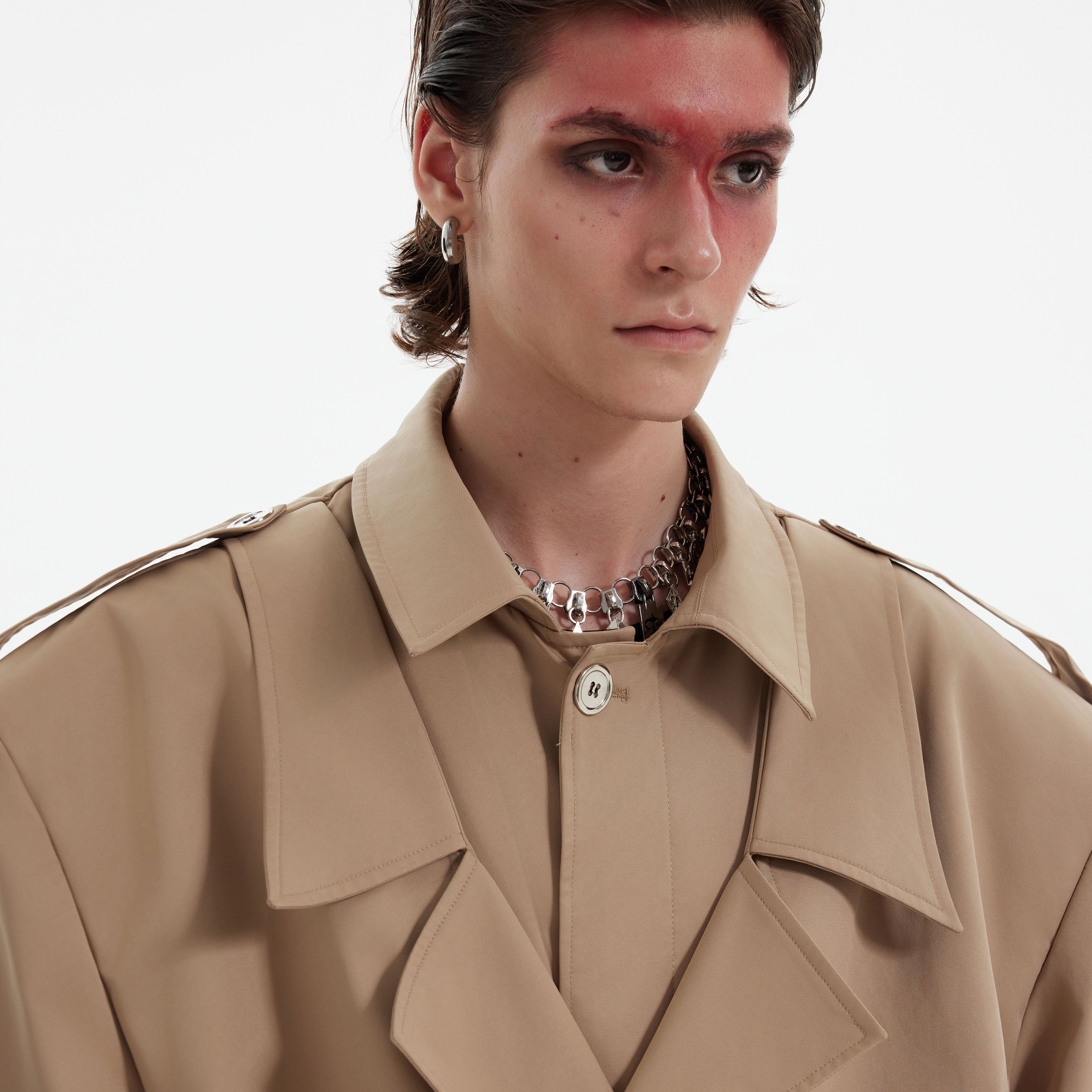 Close-up of the luxury heavyweight fabric showing refined texture and rich color saturation of the coat