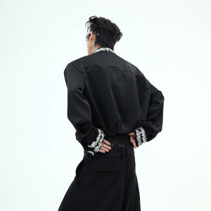 Model wearing diamond-trimmed satin shirt with detachable pads, demonstrating the perfect structured fit