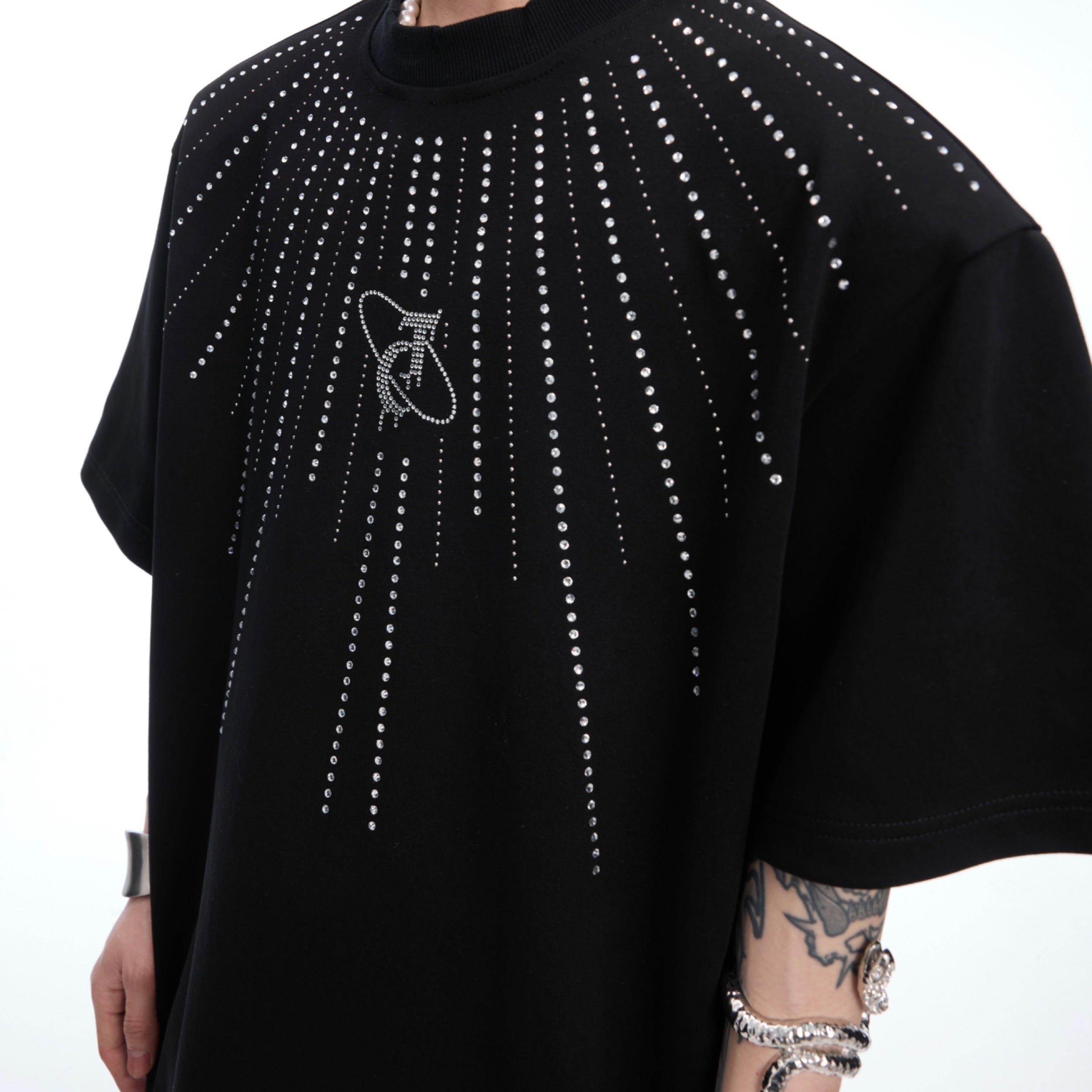 Detail shot highlighting the premium cotton blend fabric of the oversized graphic tee