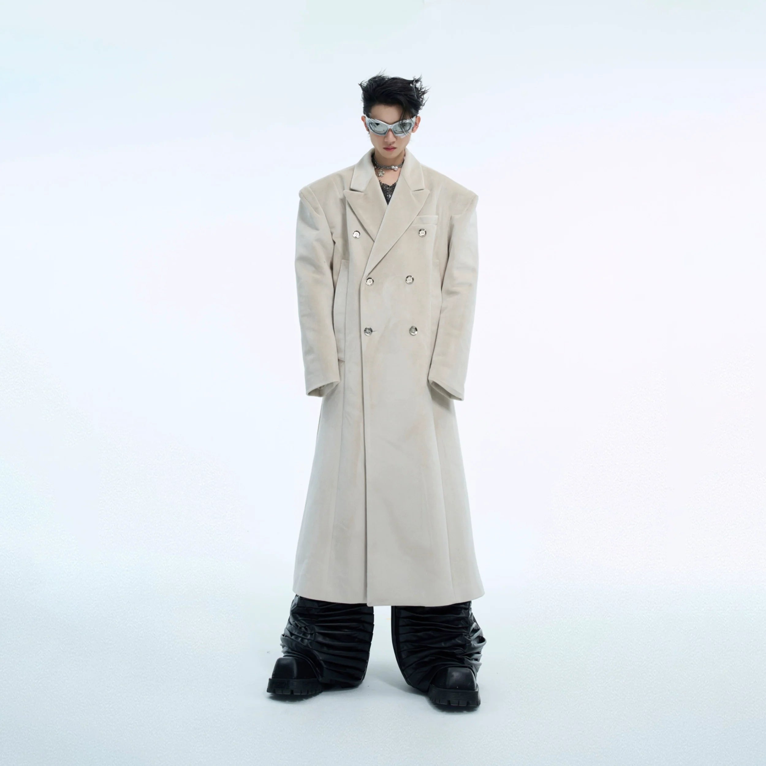 Double-breasted wool coat with metallic buttons and oversized silhouette, perfect for winter fashion