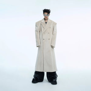 Double-breasted wool coat with metallic buttons and oversized silhouette, perfect for winter fashion