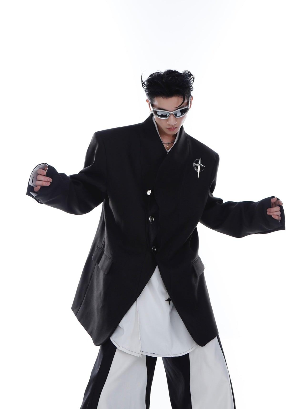 Avant-garde metal-paneled blazer with shoulder pads and collarless design, perfect for unisex streetwear fashion