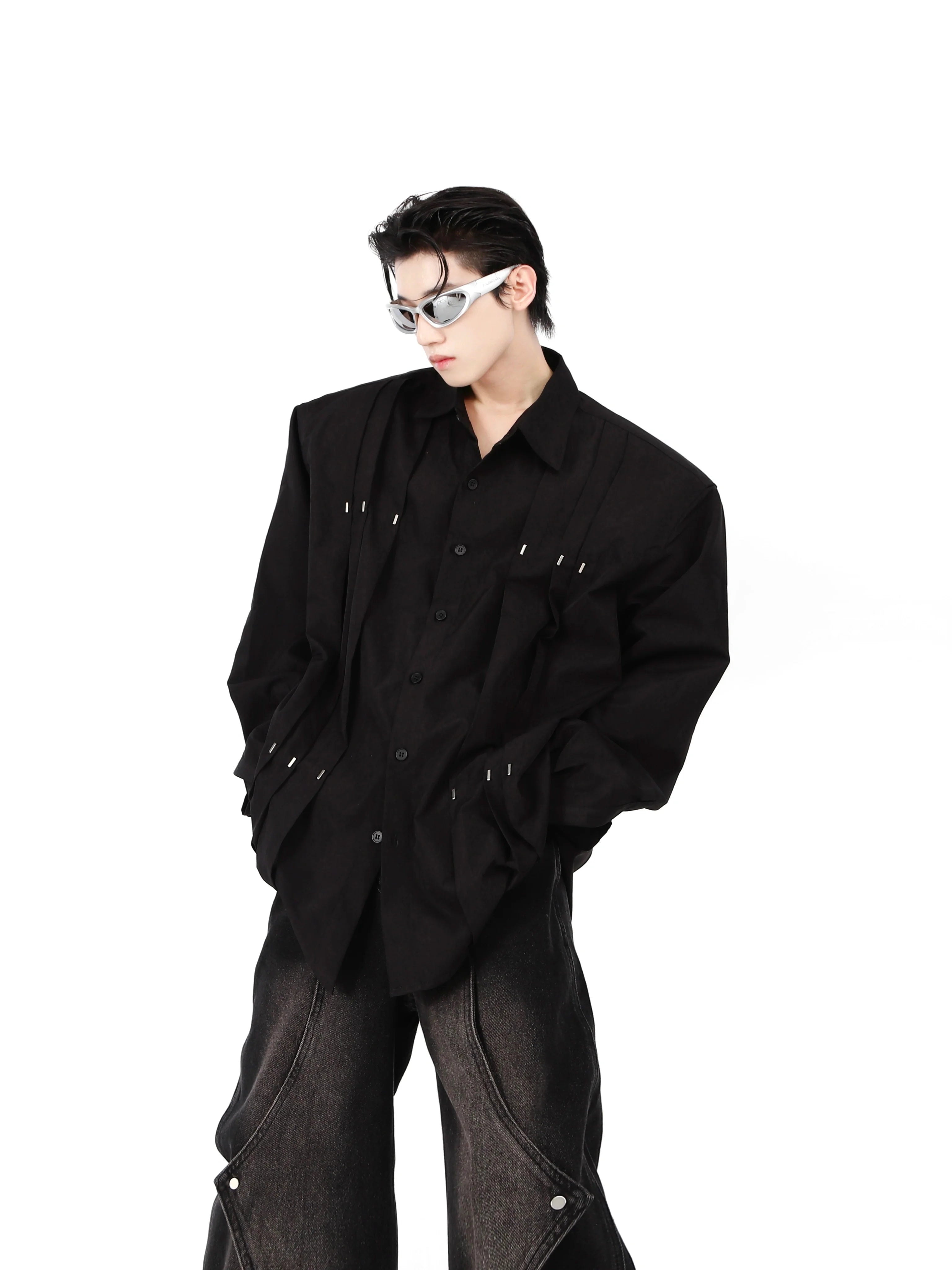 Front view of edgy cotton shirt with metal studs and shoulder pads, perfect for urban streetwear style