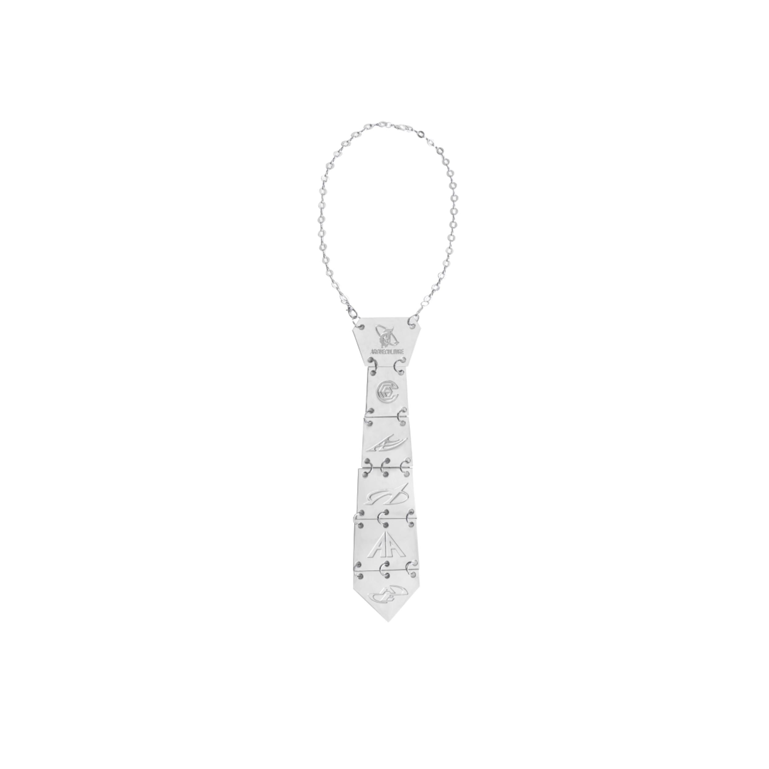 Close-up of edgy vertebrae metal tie necklace showing intricate spine details and metallic finish for bold fashion statements