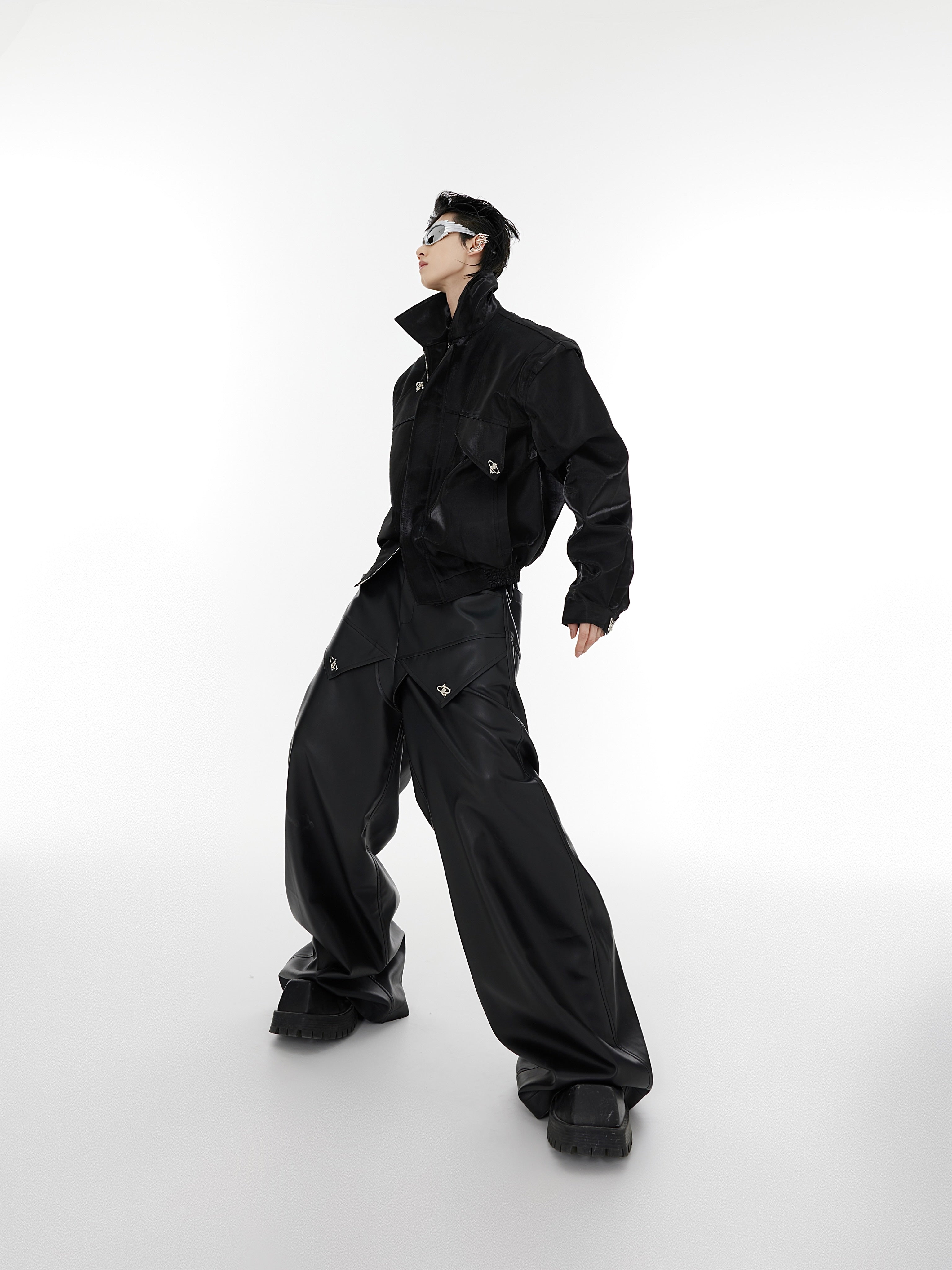 Edgy streetwear leather jacket with eye-catching metallic accents and contemporary deconstructed design