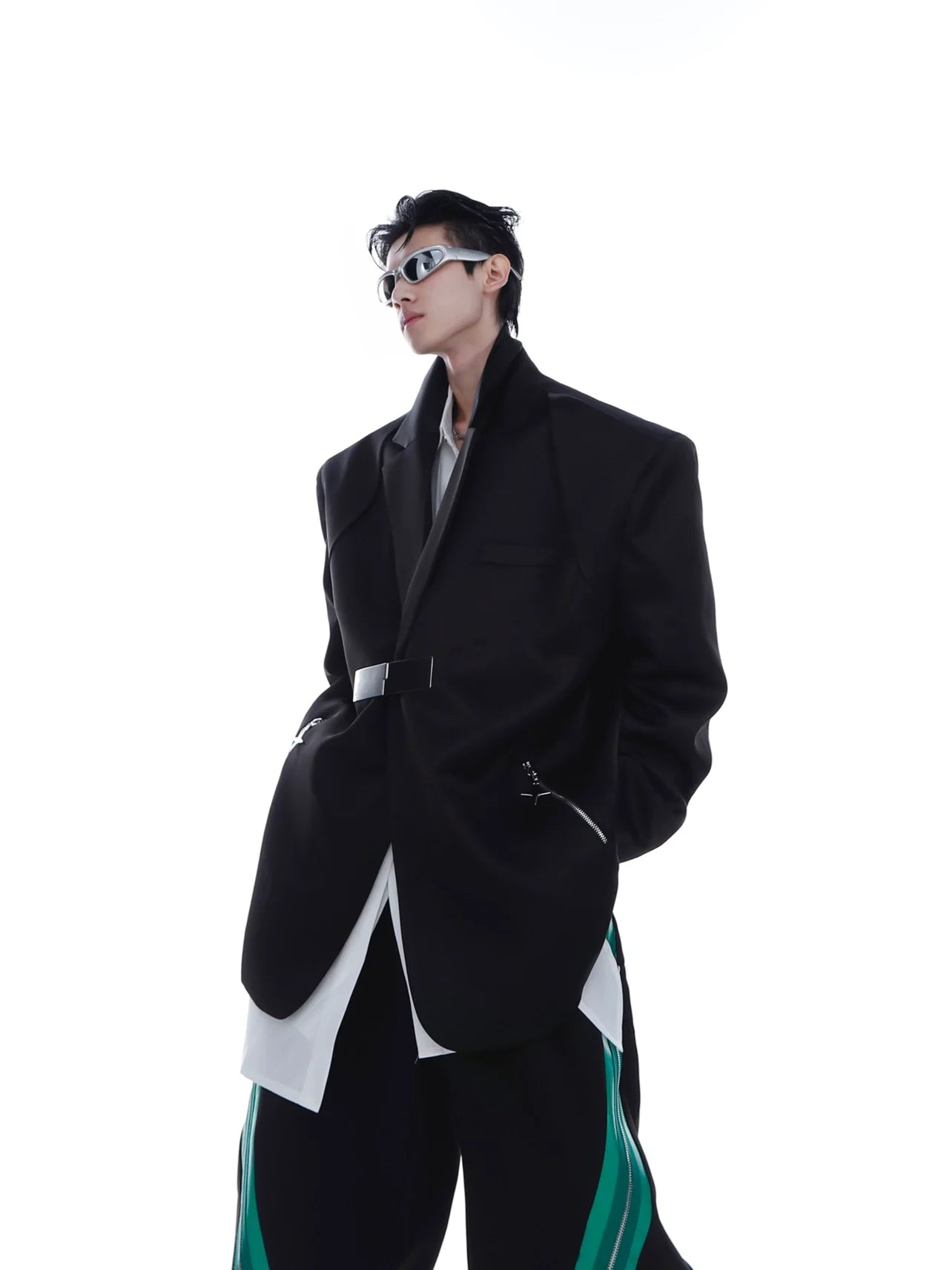 Front view of avant-garde blazer with metallic buckle details and padded shoulders, featuring a striking zipper design on icy-silk fabric