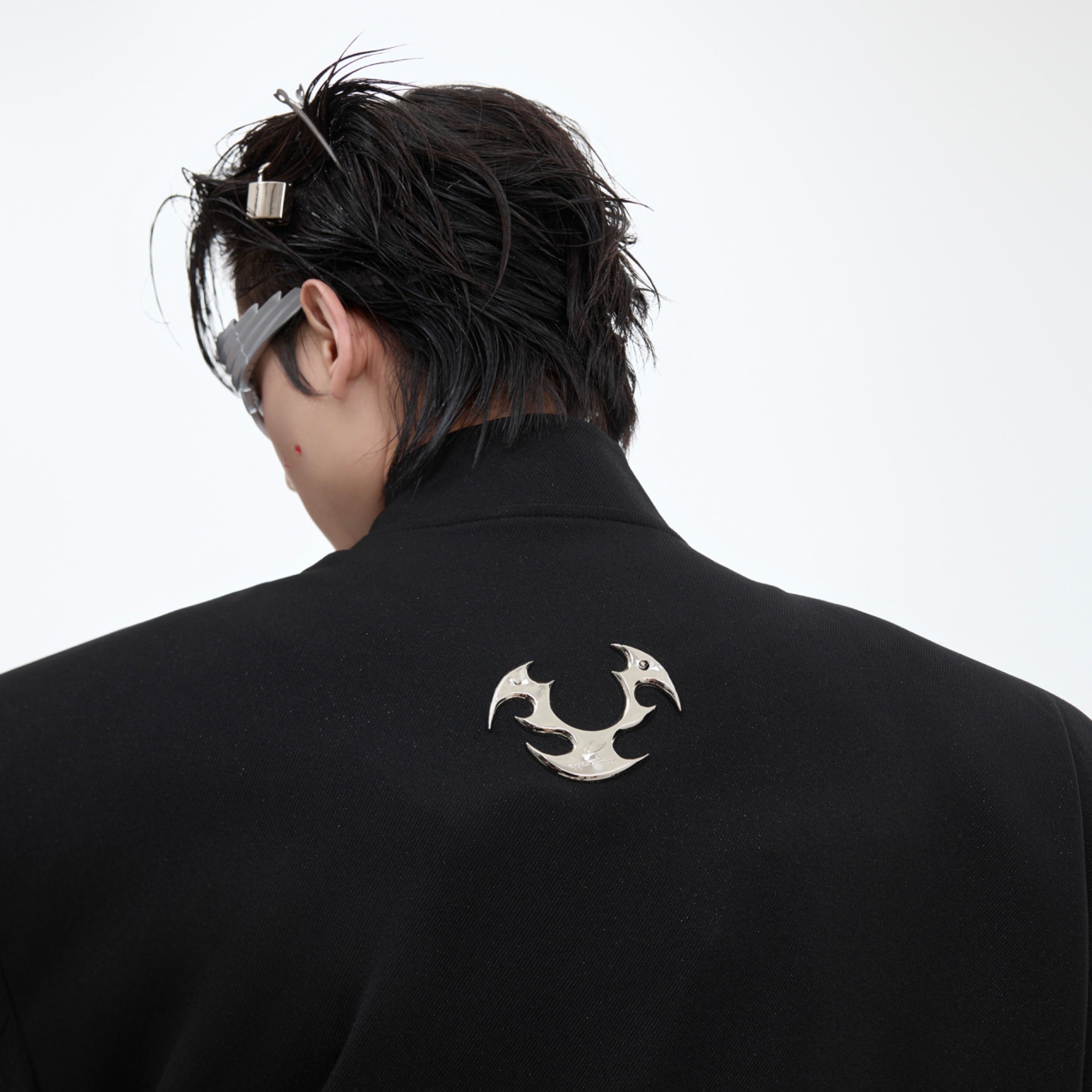 Close-up of premium metallic buttons and fabric texture on this reinvented suit jacket