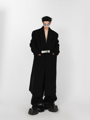 Close-up of decorative metal buttons on high-quality polyester oversized trench coat