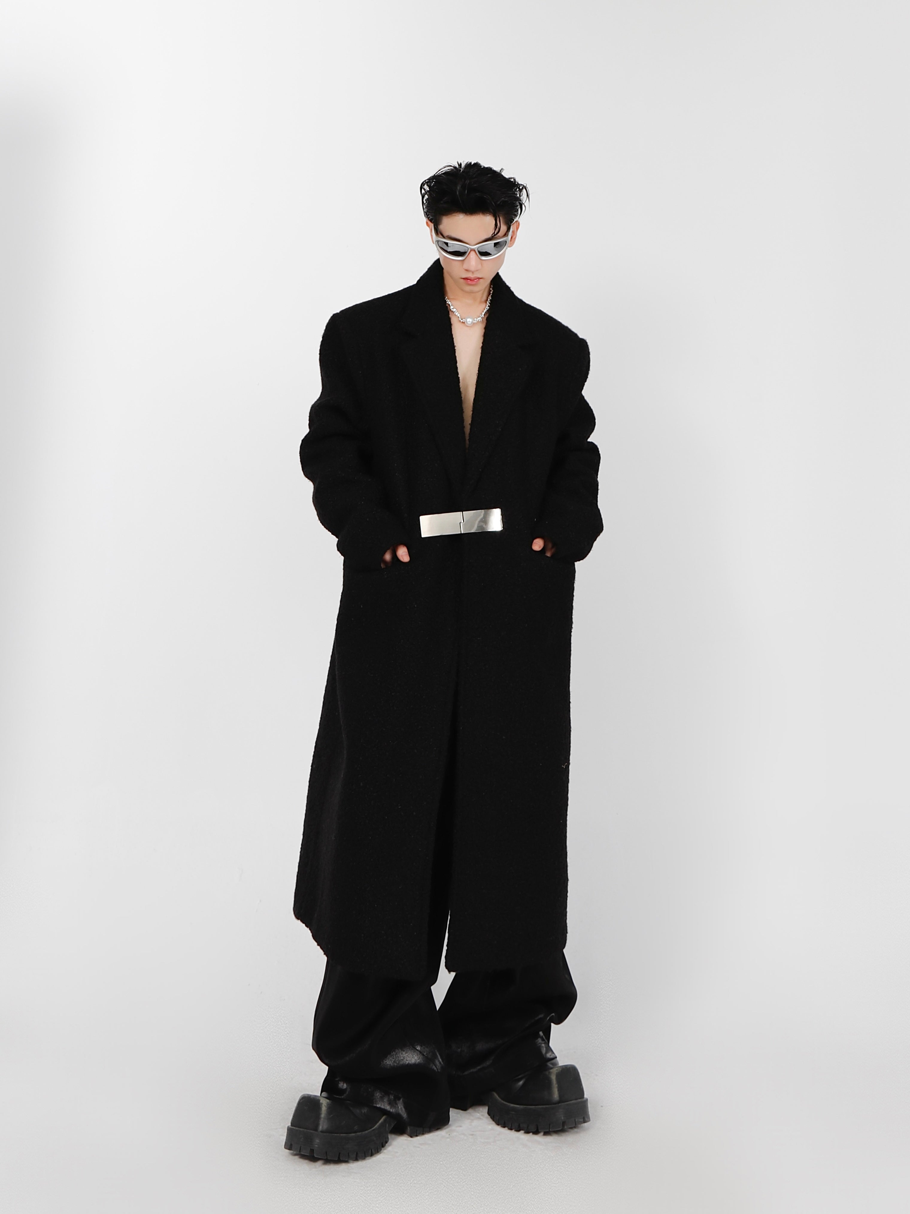 Close-up of decorative metal buttons on high-quality polyester oversized trench coat