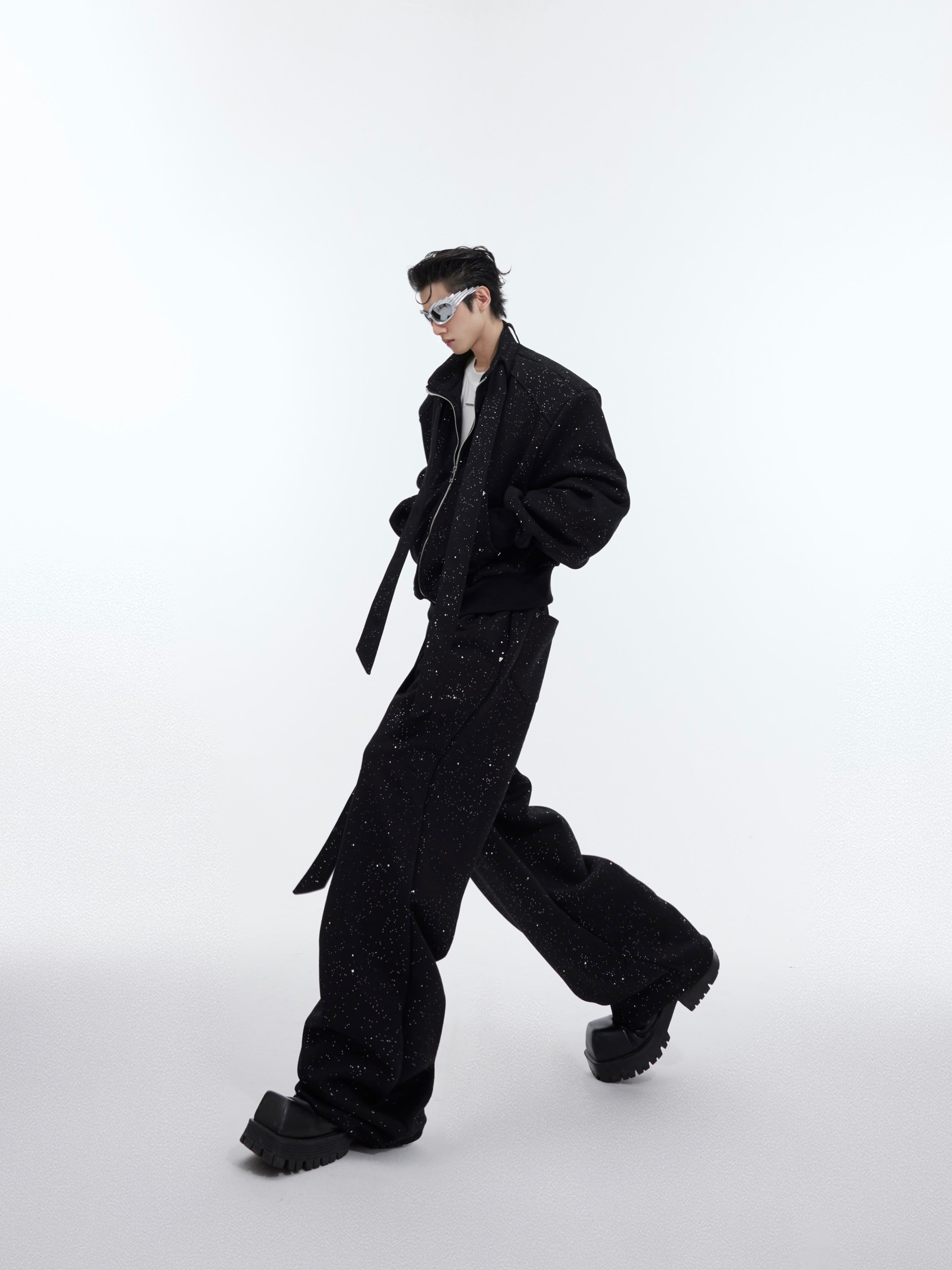 Detail showing ultra-soft micro-stretch fleece fabric of deconstructed sport suit for maximum comfort