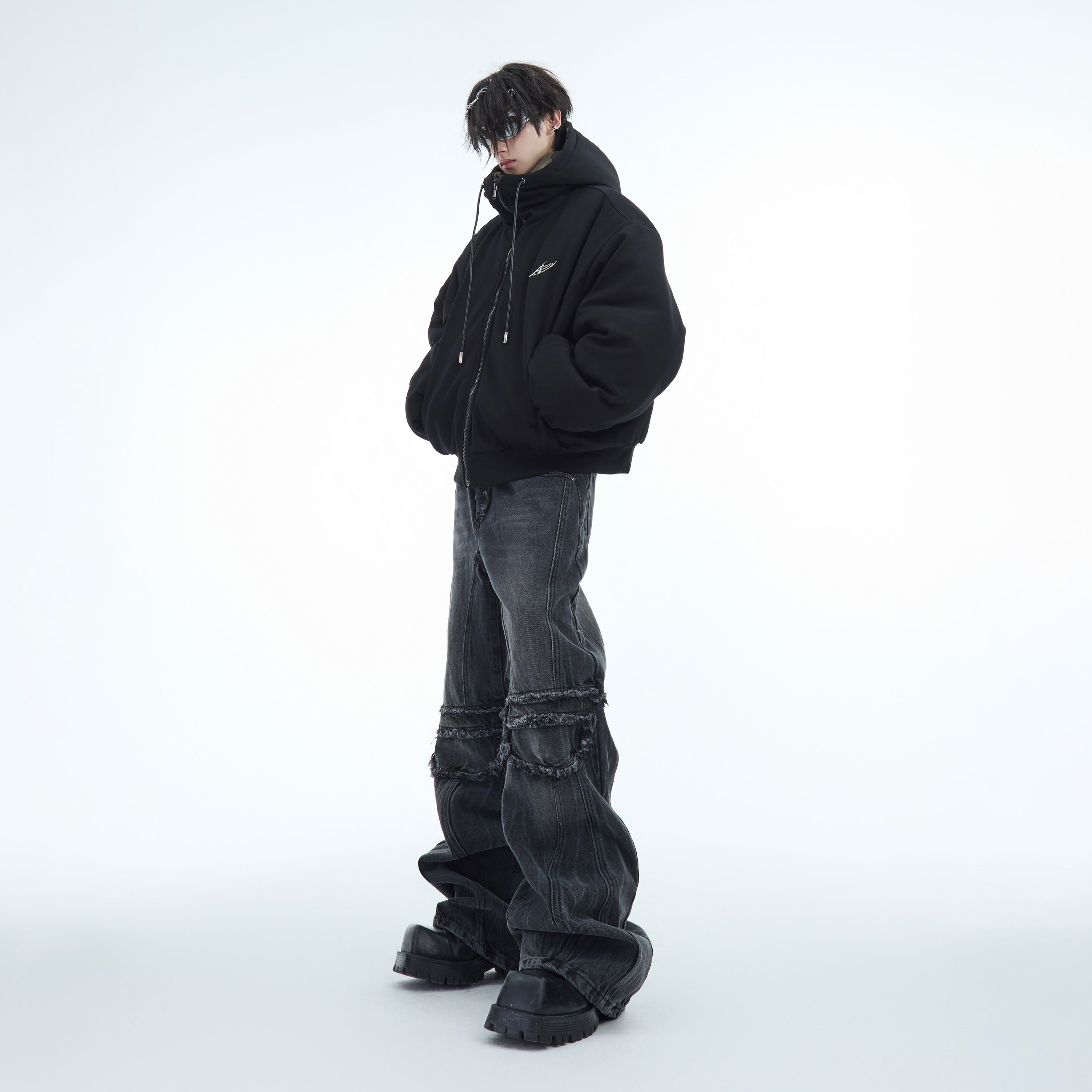 Front view of men's military camo jacket being modeled, highlighting oversized streetwear silhouette