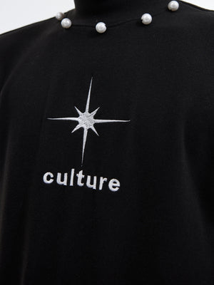 Close-up of deconstructed print details on premium mock neck streetwear tee