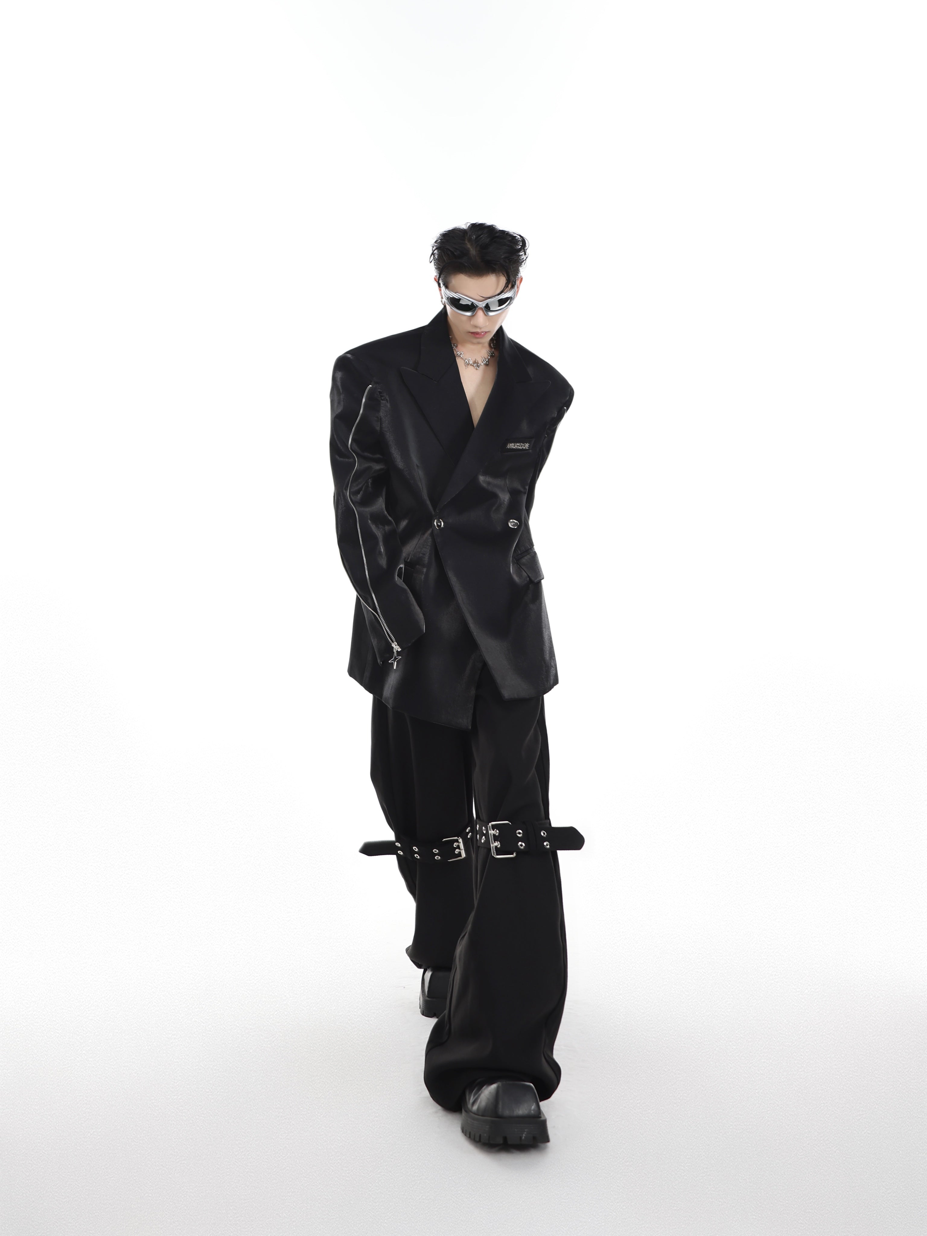 Blazer in motion showing how the liquid metal fabric creates dynamic light reflections with every movement.