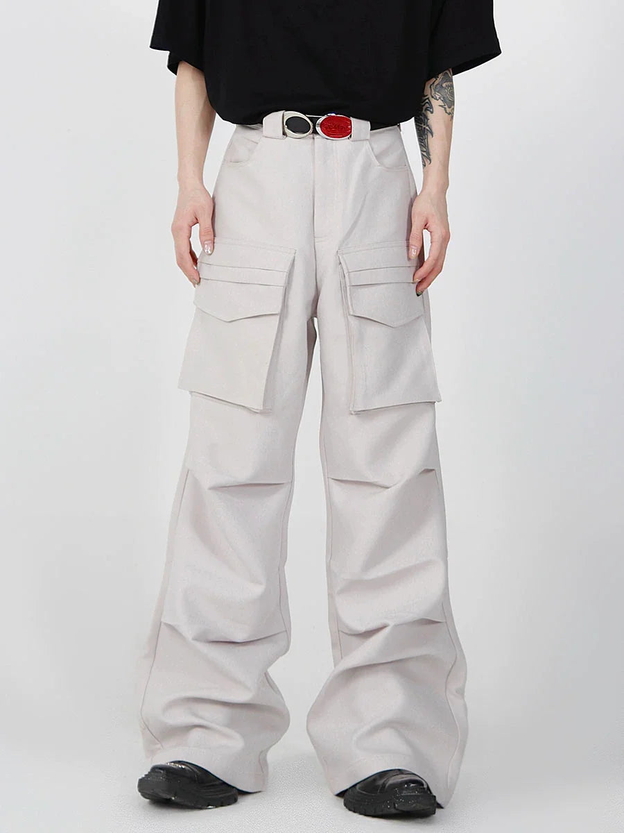 Front view of oversized cargo pants with patch pockets and drop-crotch design, perfect for urban streetwear style