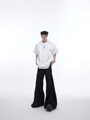 Streetwear model wearing the oversized deconstructed tee, highlighting the relaxed fit and textured fabric quality