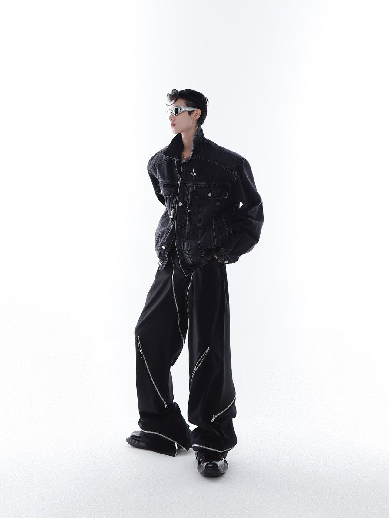 Back view of the avant-garde cropped denim jacket showing its unique oversized streetwear design