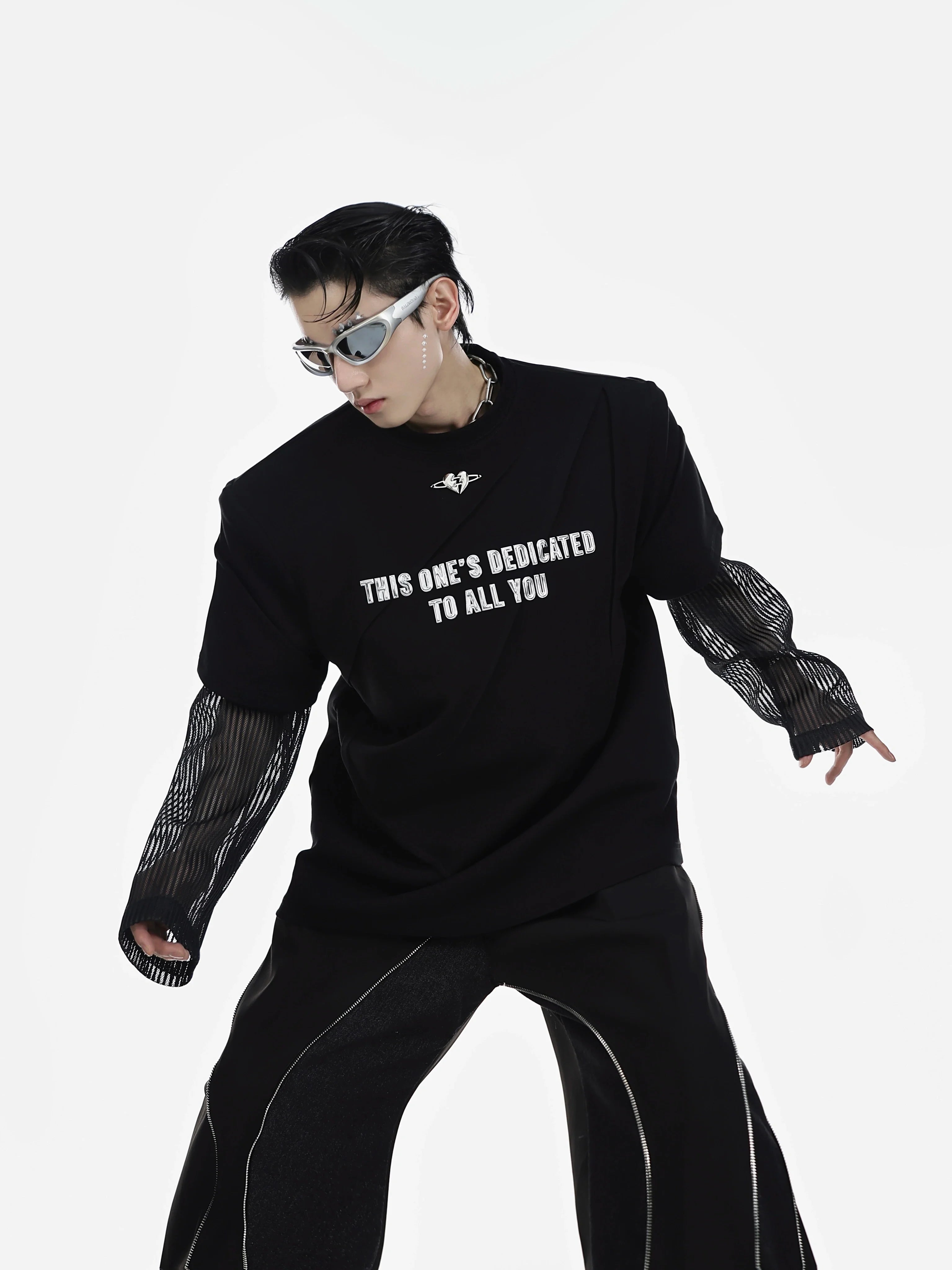 Front view of men's oversized graphic tee featuring bold metal letter print, drop shoulder design for urban streetwear look