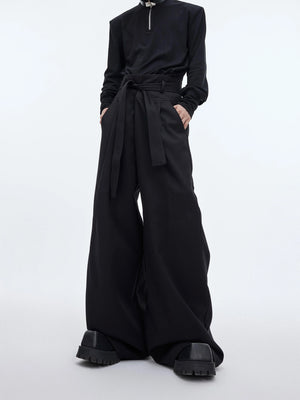Oversized high-waist trousers with unique spliced streamer details, wide-leg streetwear pants for urban fashion