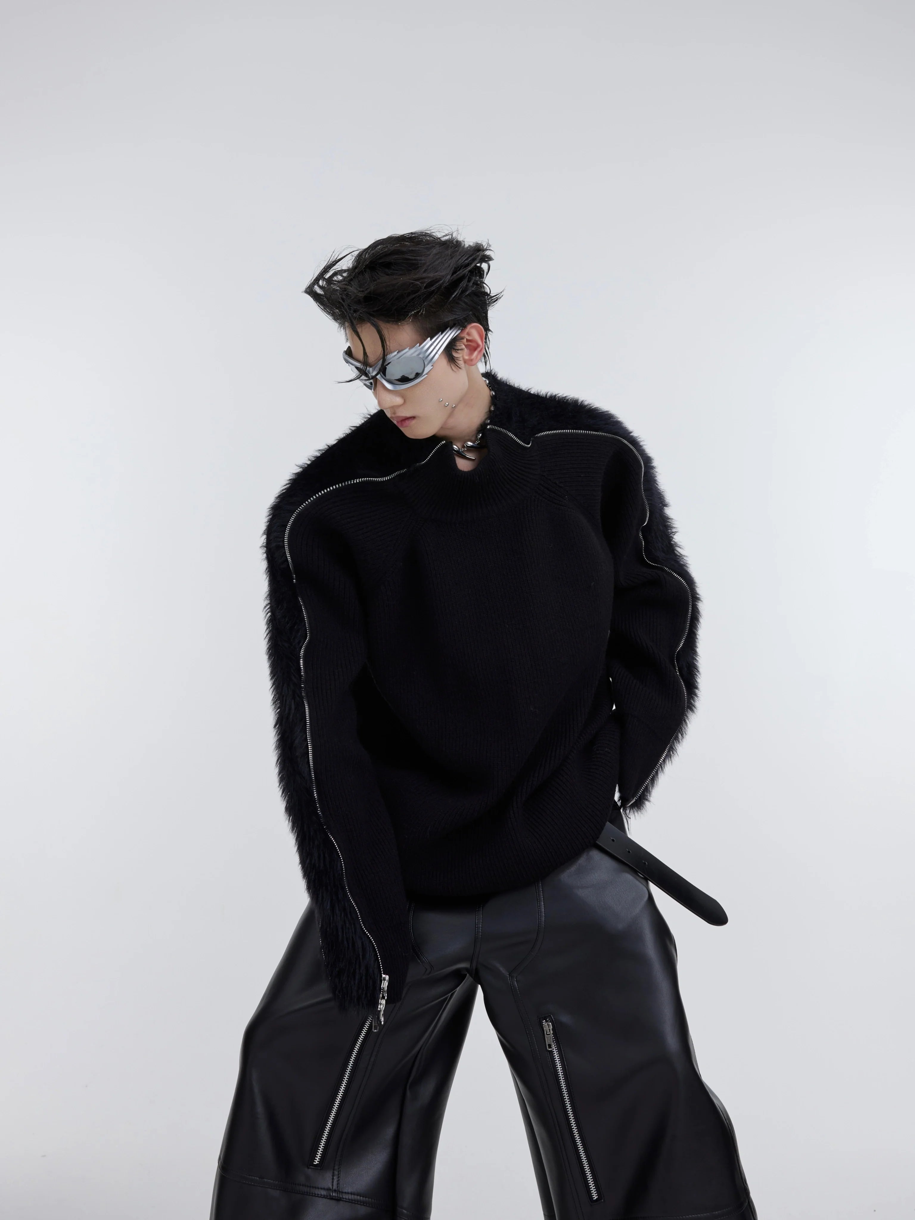 Front view of oversized knit sweater with unique dual zipper design, showing fleece texture and urban streetwear style